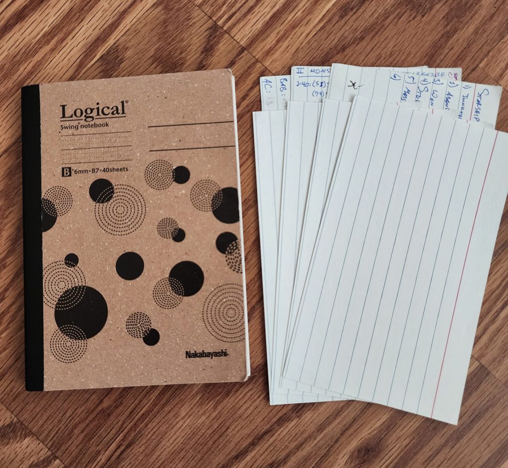 The Logical Swing, B7 sized notebook from Nakabayashi, sits next to seven 3x5 index cards.