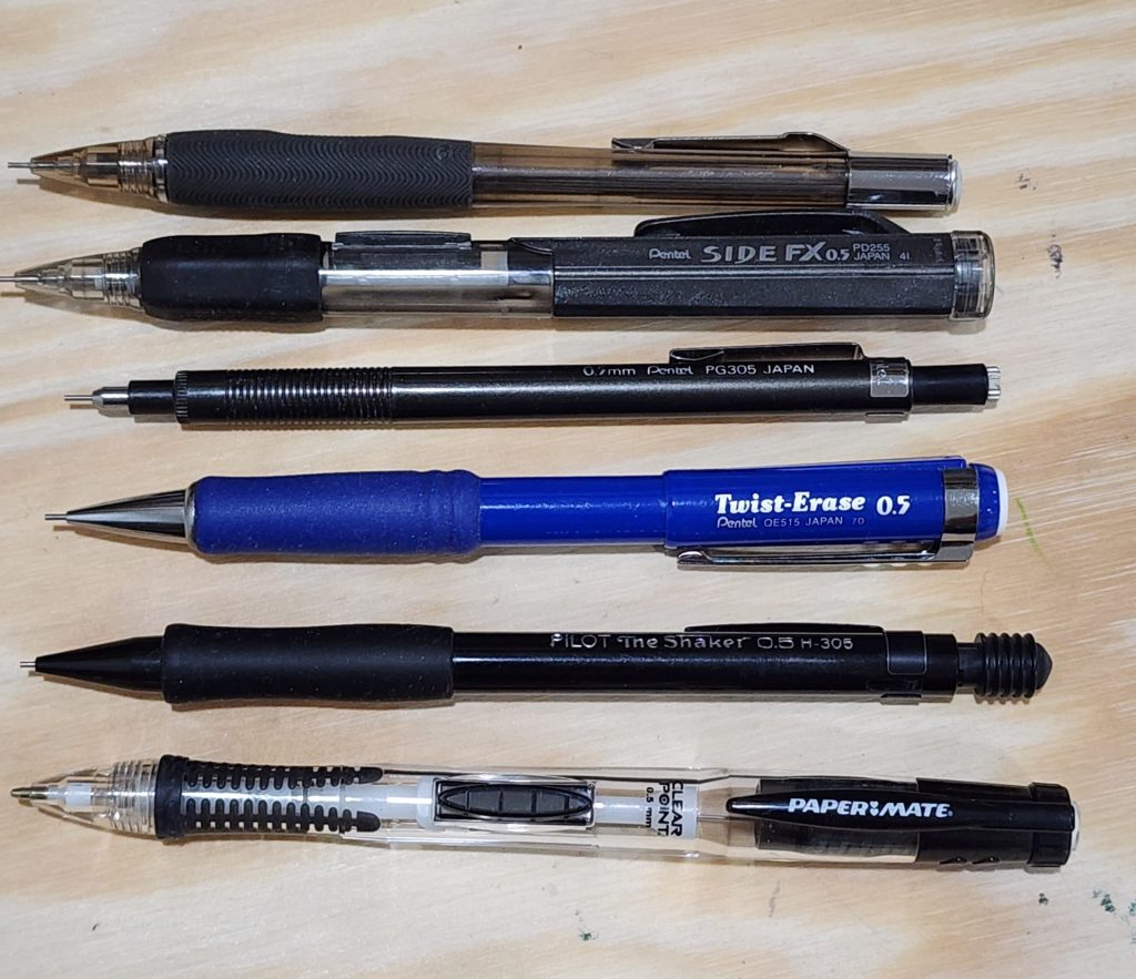 A lineup of six mechanical pencils, from Pentel, Pilot and Paper Mate.