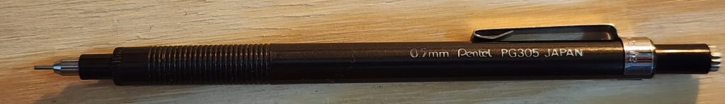 A closeup photo of the solid black barrel of the Pentel PG305 mechanical pencil.