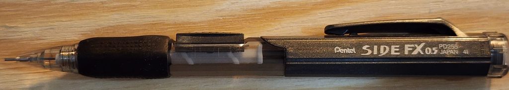 A closeup photo of the grey and clear Pentel Side FX PD255 mechanical pencil.