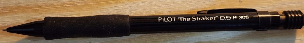 A closeup photo of the solid black barrel of the Pilot The Shaker H-305 mechanical pencil.