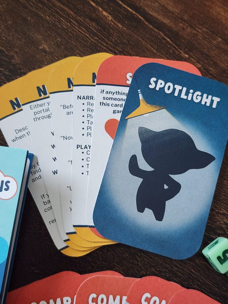 A set of Narrator cards, with gameplay instructions, a Spotlight card, and a Safety card, with a large red X, from the X-card safety tools.